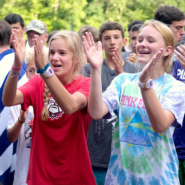 clapping kids at overnight coed summer camp